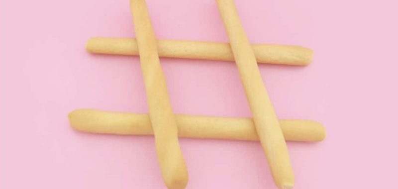 Breadsticks used for hashtag on pink background